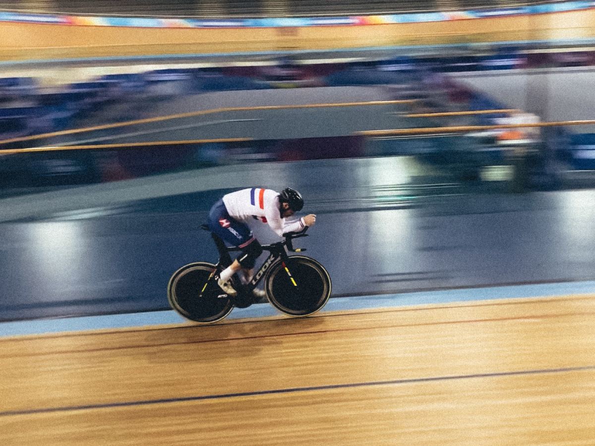 Blaine Hunt riding on a velodrome in Great Britain kit